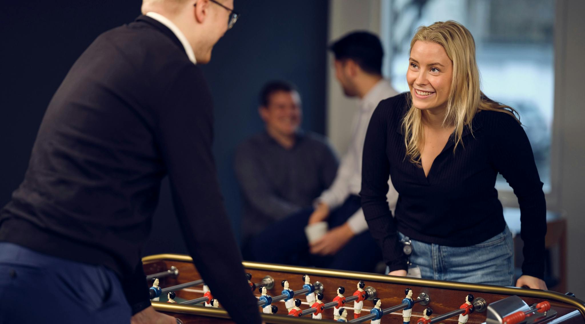 Two people playing table football